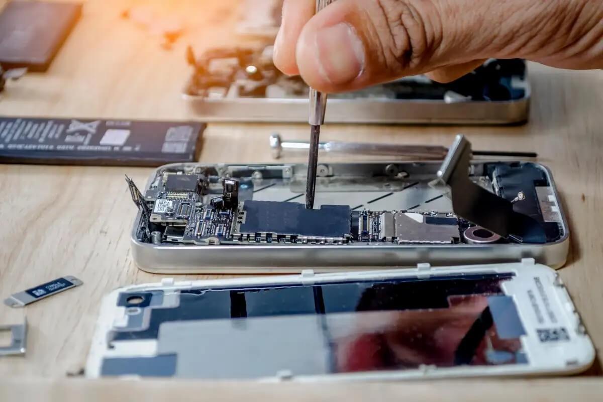 Technician repairing Apple device